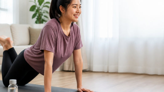 A woman doing a push-up on a mat at home as one of her breast firming exercises